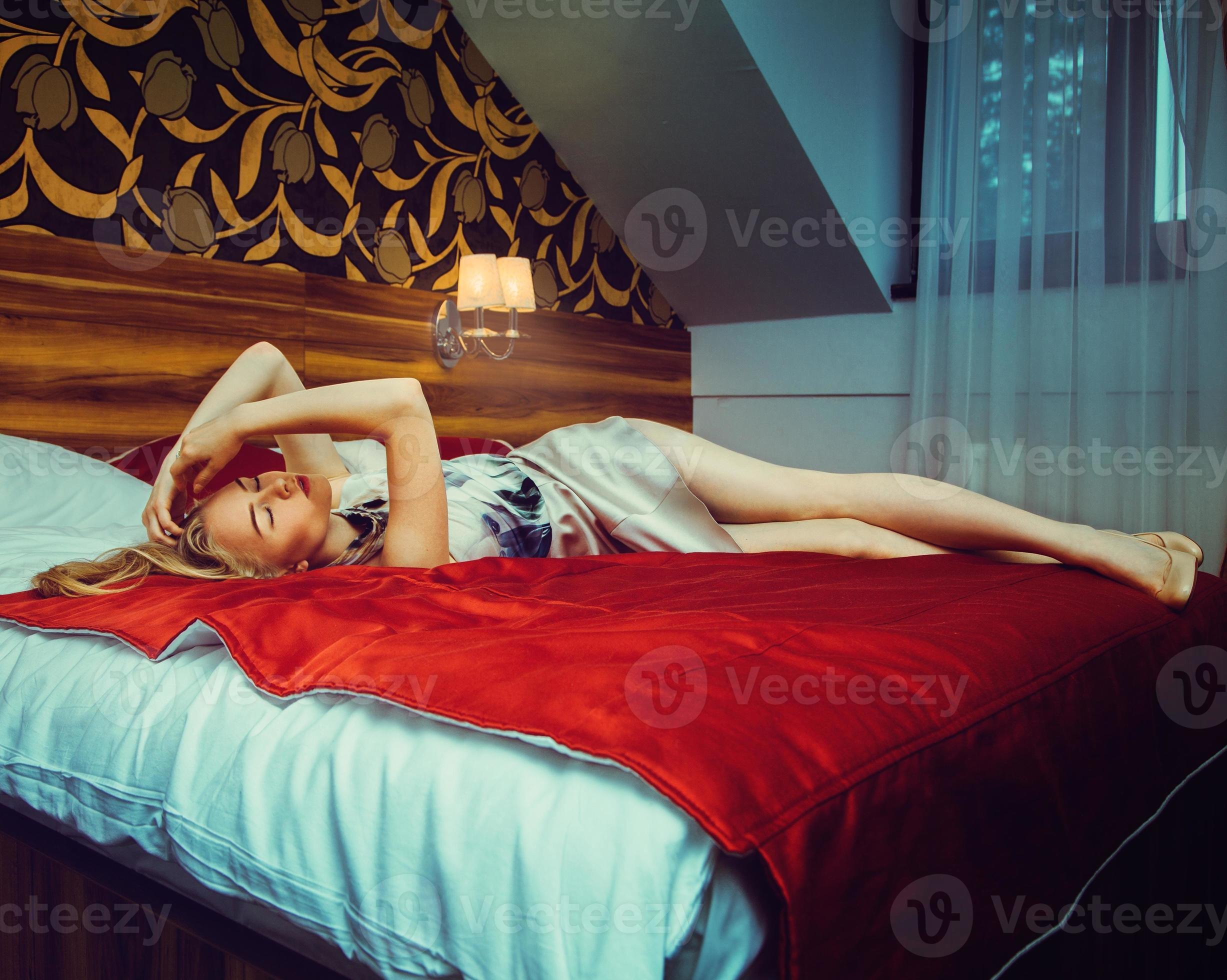 Photos - Sexy Adult Blonde In Short Dress With Beauty Long Legs Lying In