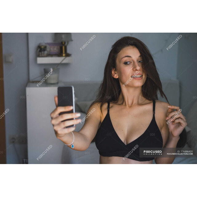 Selfies Lingerie - Brunette Girl In Black Bra Taking Selfie In Bedroom. Attractiv